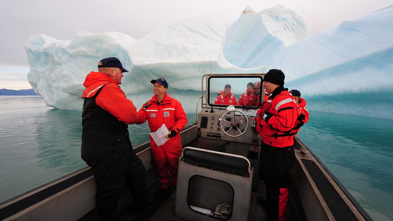 Coast Guard and sailors wearing cold weather boating gear