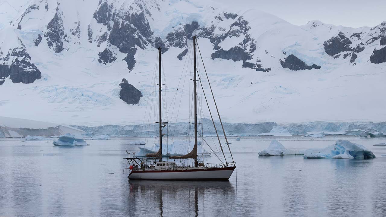 sailboat cruising through icy cold water