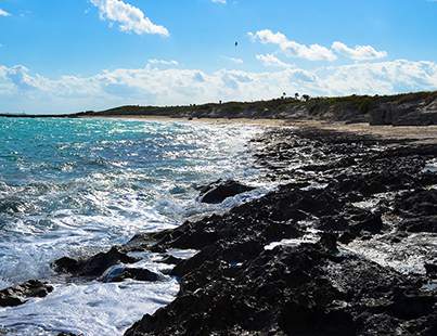 ocean spray on the rocks of a Cuban beach