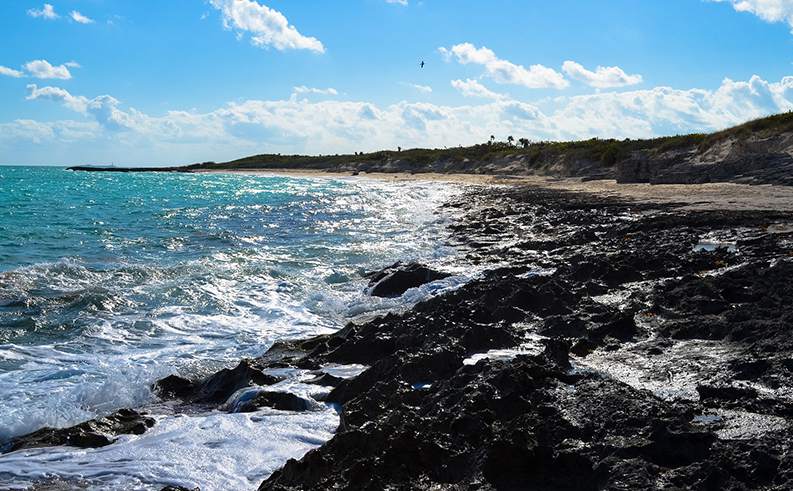 ocean spray on the rocks of a Cuban beach