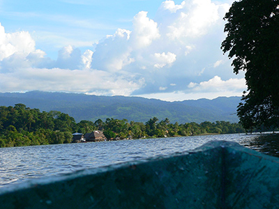 Canoe going down the Rio Dulce river in Guatemala