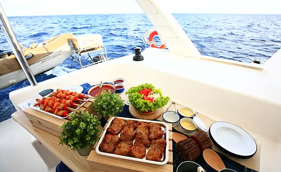 eating well lunch at sea on a catamaran sailboat