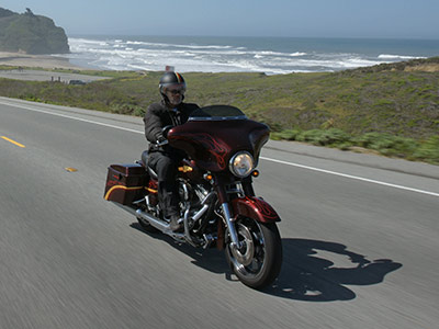 motorcycle riders cruising seaside