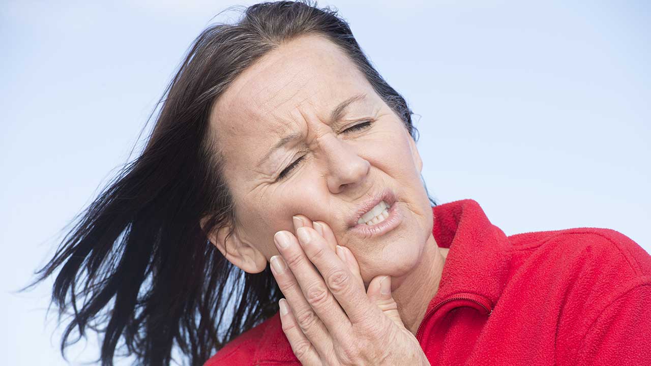 Boater woman with toothache jaw pain